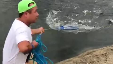 Fishing by net in small river