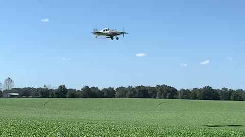 Crop duster spraying a spinach field in Florida.