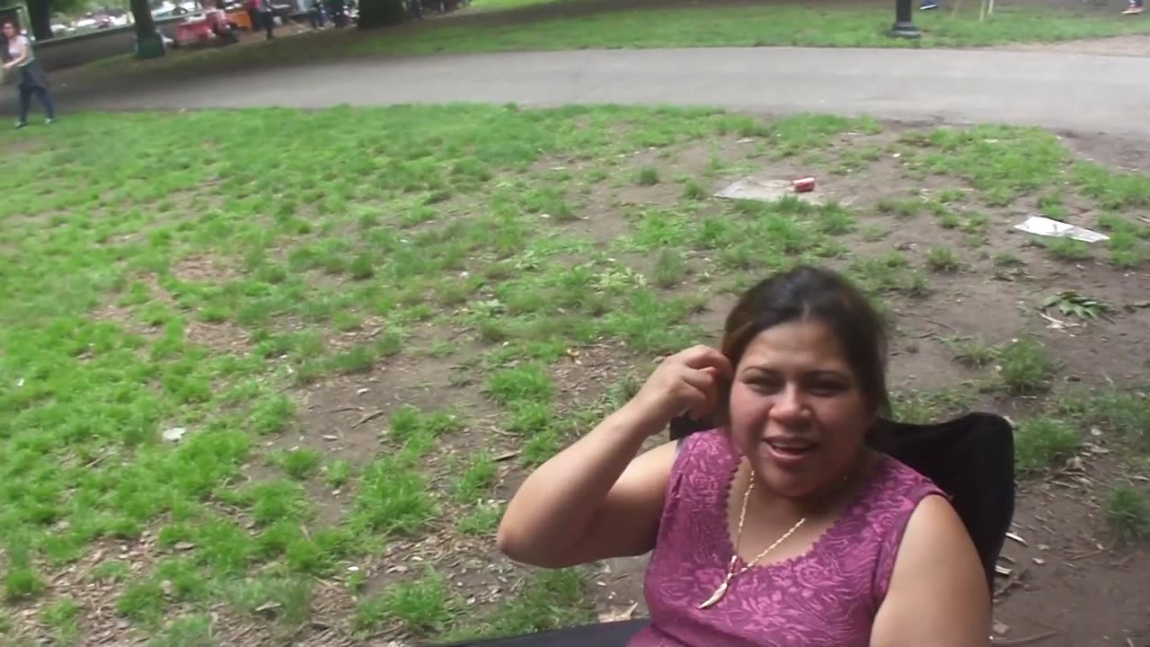 Luodong Massages Mexican Woman In Pink Shirt At The BBQ