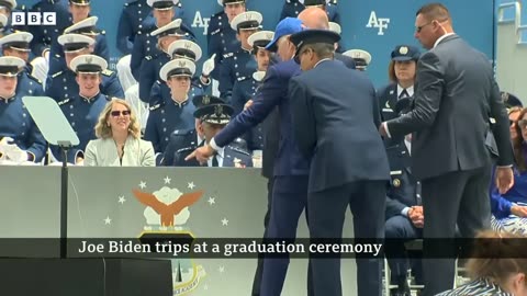 US President Biden trips and falls over at graduation event