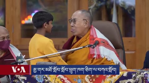 Dalai Lama Kissing a boy at a Buddhist event and try to touch his tongue