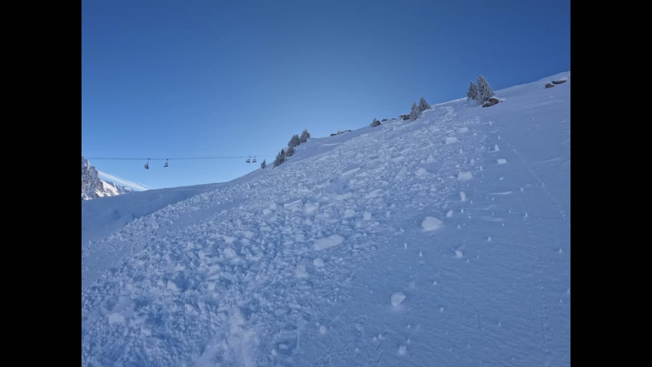 Skier in snowslide, Méribel France