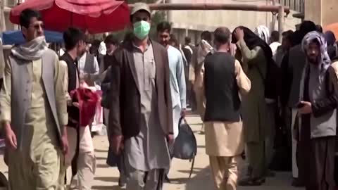 Afghans gathered near Kabul airport said they faced miserable conditions