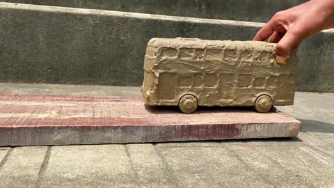 Drive the Muddy Toy Vehicle by hand and threw it into the water for cleaning