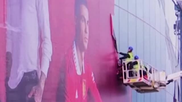 have begun taking down a mural from Old Trafford
