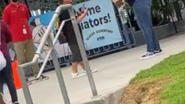 Sweet kid gives flowers to kind and patient teacher