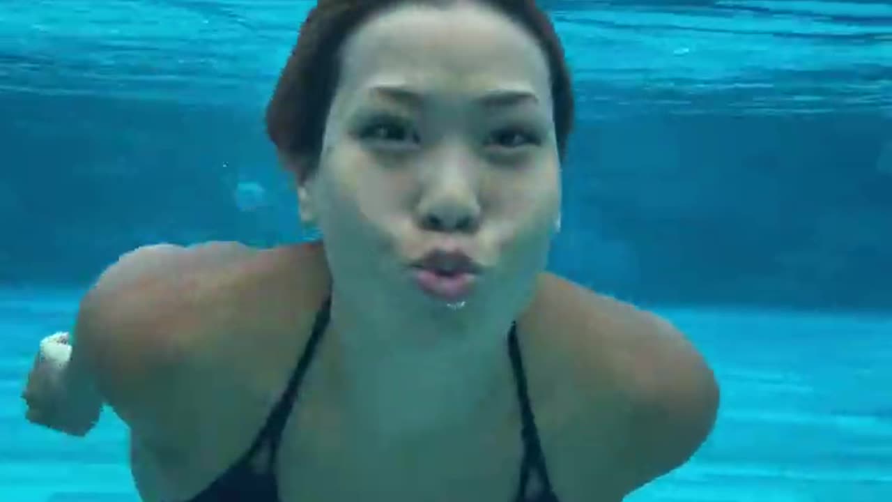 Woman Swimming Underwater in a Tropical Pool RANDOM VIDEO OF THE DAY (DAY 79