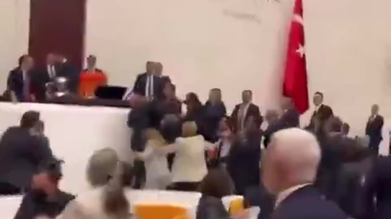 Fist fight in the Turkish Parliament today between MPs of Erdogans party and Kurdish MPs.mp4