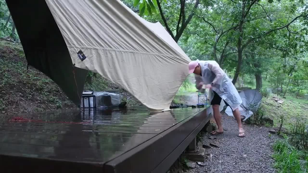 Camping in the rain, enjoying outdoor food alone