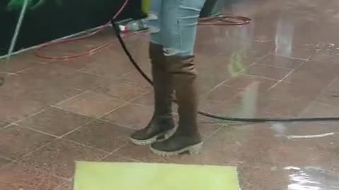 She is washing the carpet