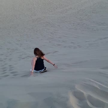 Sand boarding down the hill!