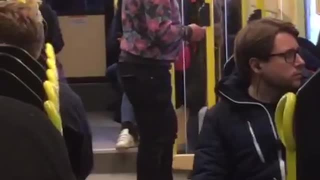 Sunglasses pink sweater man dances on bus in stockholm sweden