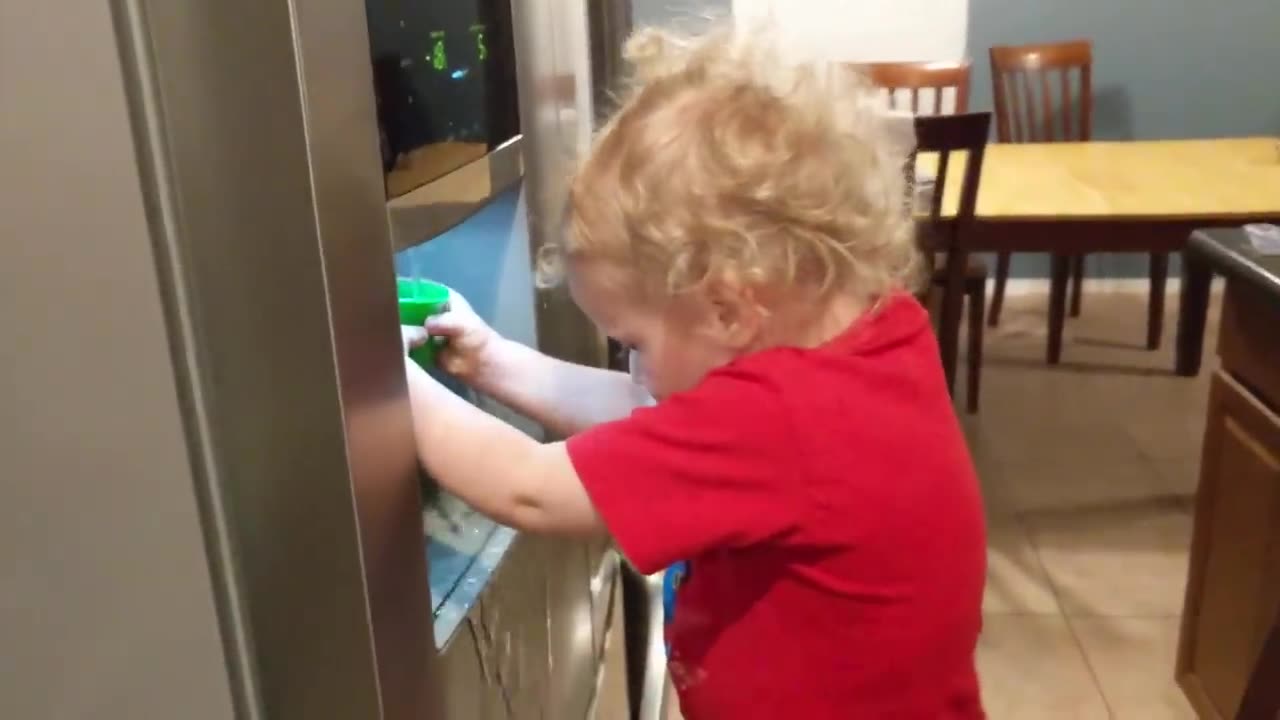 Funny baby on fridge