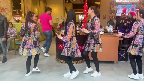 Turkish ice cream salesman dance with a girl