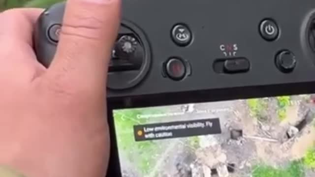 Ukrainian drone team dropping a bomb on a Russian trench