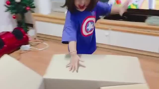 A happy daughter receiving a present