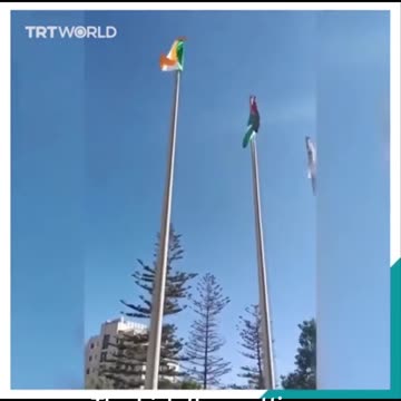 THE IRISH FLAG GETTING RAISED IN RAMALLAH PALESTINE