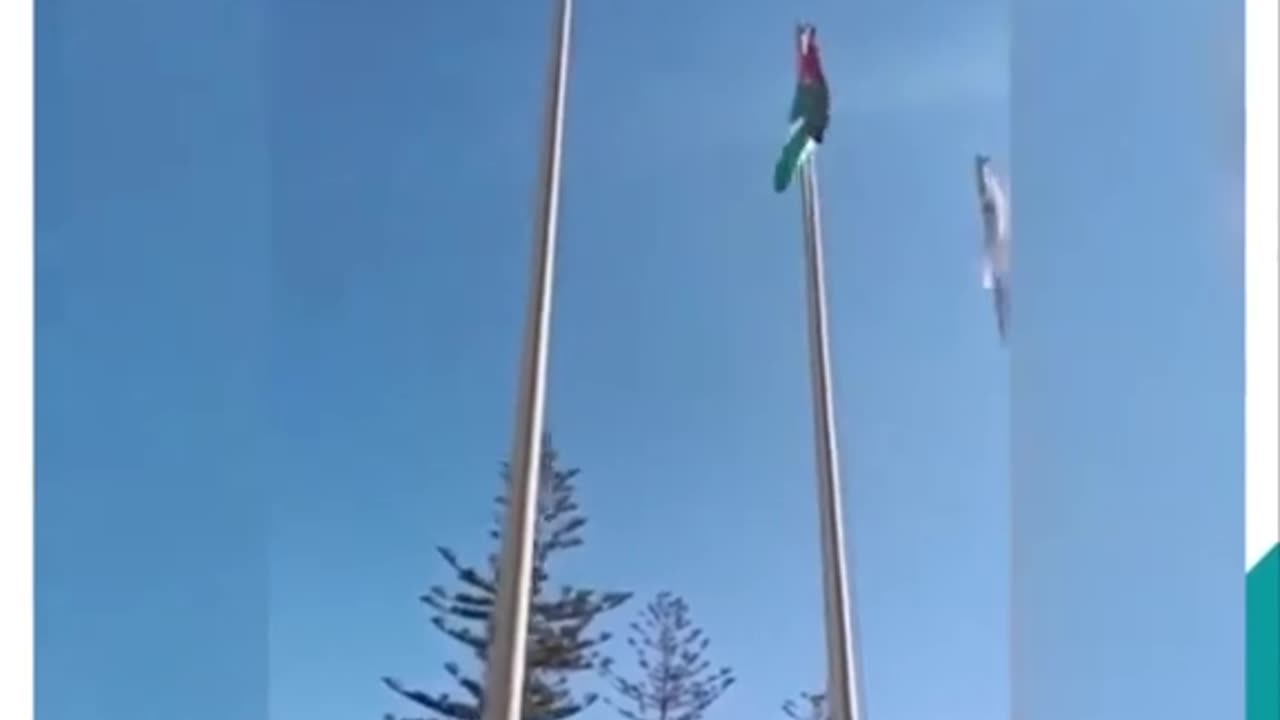 THE IRISH FLAG GETTING RAISED IN RAMALLAH PALESTINE