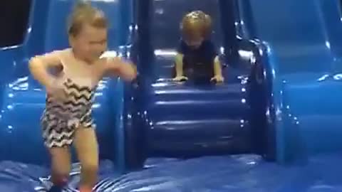 Collab copyright protection - toddler boy face plants blue slide