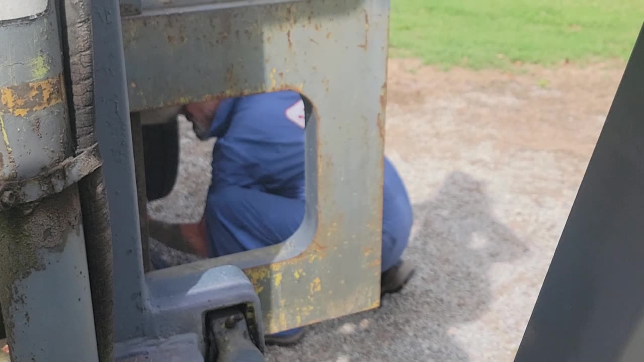 WIFE OPERATES FORKLIFT WHILE HUBBY PREPARES FOR BRAKE PAD JOB