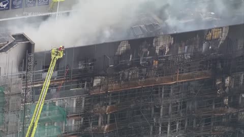 Fire engulfs apartment building in east London, sending at least 2 to hospital