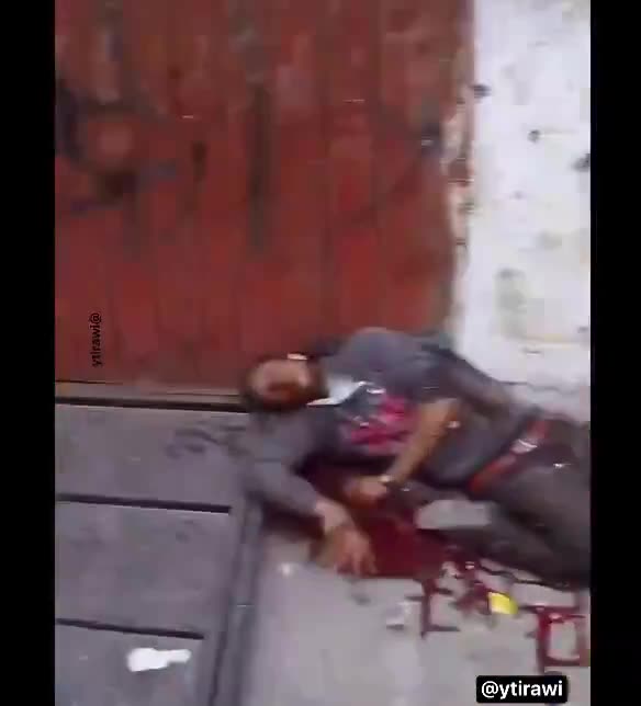 Israeli soldiers execute a civilian & do a special handshake afterwards?