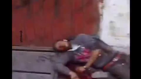 Israeli soldiers execute a civilian & do a special handshake afterwards?