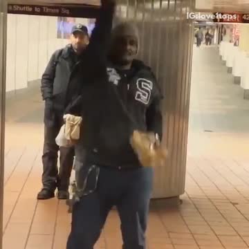 Music guy dancing with teddy bear in subway