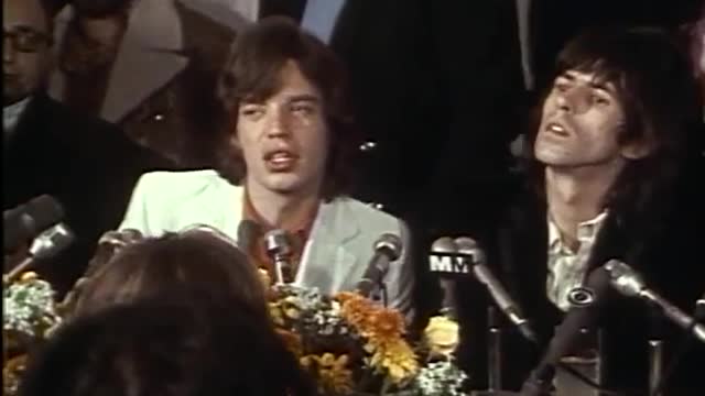 Mick Jagger and Keith Richards speaking to press