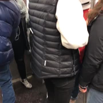 Red astronaut space suit on subway