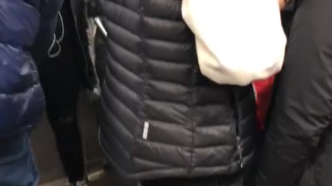 Red astronaut space suit on subway