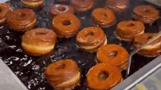 Hot fresh glazed donuts for everyone. Do you like donuts Friendly Donuts in Orange