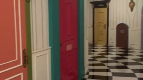 A room full of doors from Alice in Wonderland