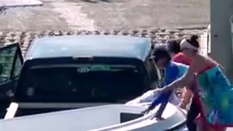 LADY JUMPS IN! BOAT SINKING THEIR TRUCK!