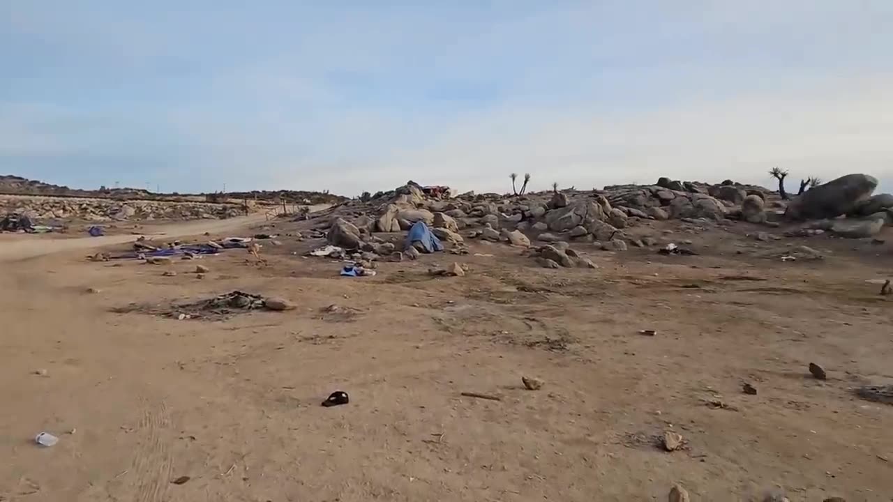 Man is following a group of illegal migrants who have just crossed the border in California