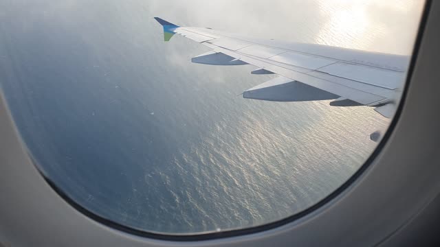 The view from the plane. There's a lot of clouds.