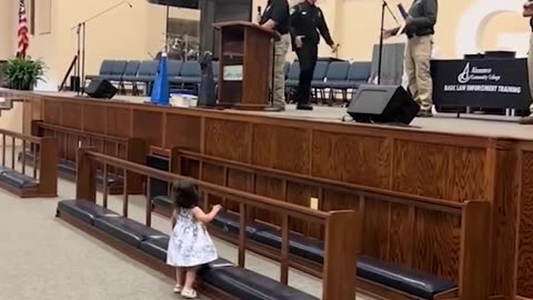 Little girl has cutest reaction to dad's police graduation