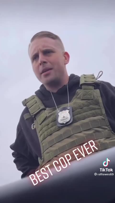 Patriot Cop - takes off Biden Harris Bumper Sticker