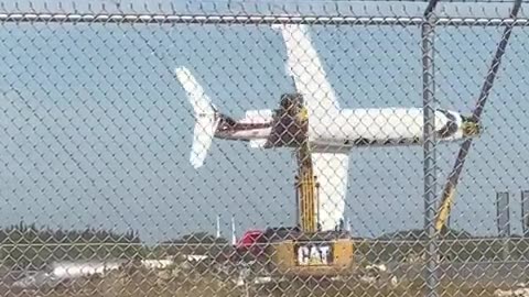 Excavator operator playing with a scrapped plane! (no audio)