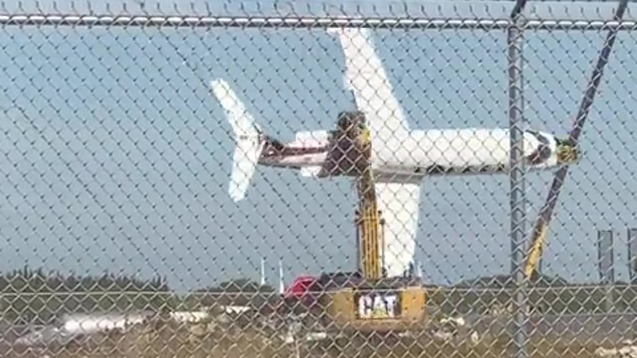 Excavator operator playing with a scrapped plane! (no audio)