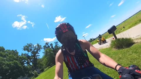 Motorcyclist's Grassy Dismount