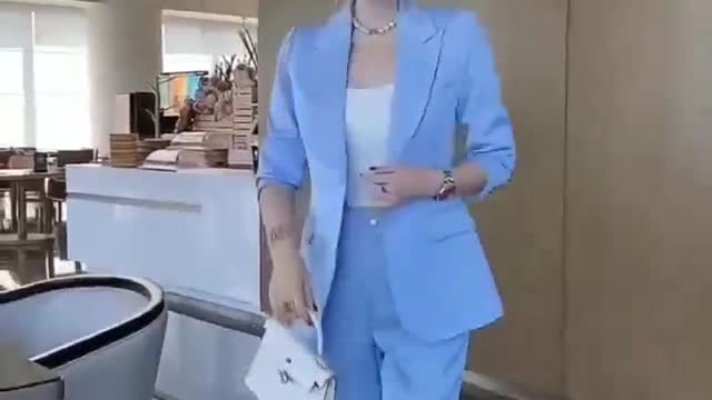 Sky blue suit with white high heels