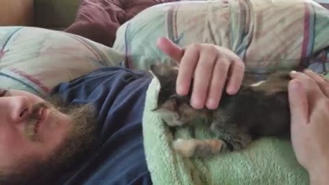 Man Breastfeeding cat