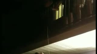 Shirtless man hangs from ceiling and falls
