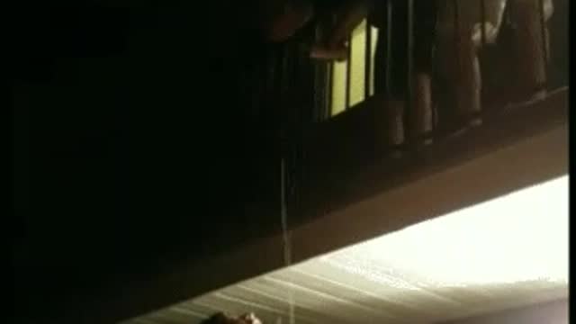 Shirtless man hangs from ceiling and falls