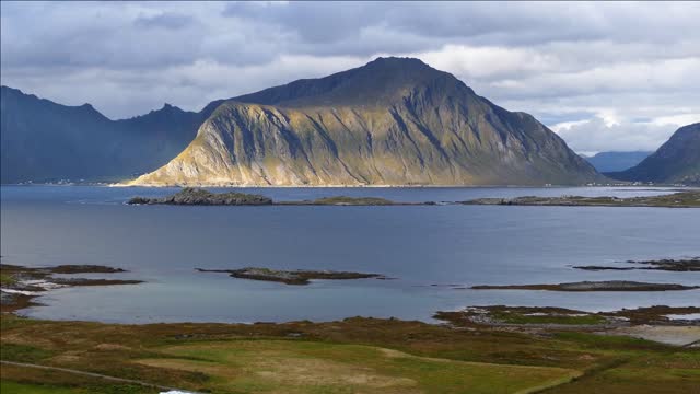 mountain and lake landscape around fredvang in norway