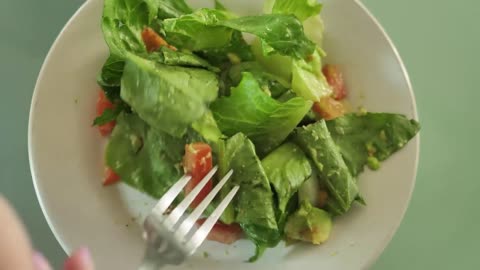 Eating salad with a fork