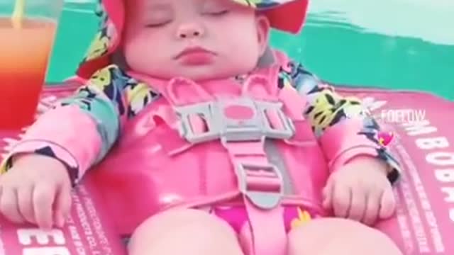 Cute Adorable Baby Relaxing In The Pool