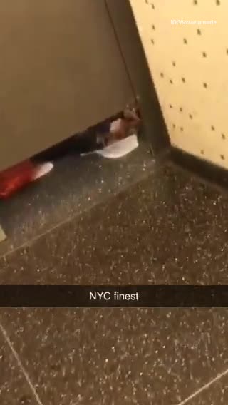 Woman gives herself a pedicure in bathroom stall floor