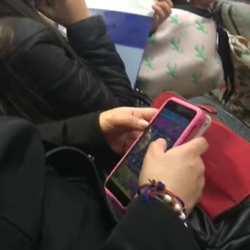 Woman falls asleep on phone on bus